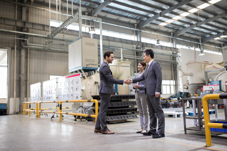 business partners meeting in a warehouse